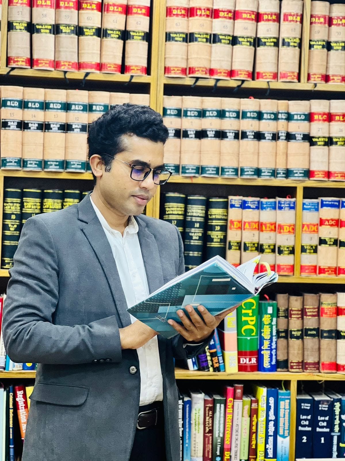 Legal counsel reviewing law reports